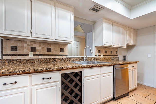 kitchen with white cabinetry, decorative backsplash, and wine cooler