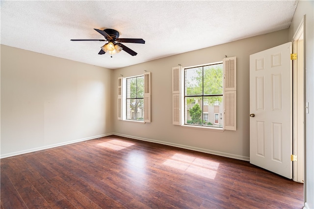 unfurnished room featuring a textured ceiling, dark hardwood / wood-style floors, and ceiling fan