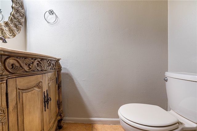 bathroom with tile patterned floors and toilet