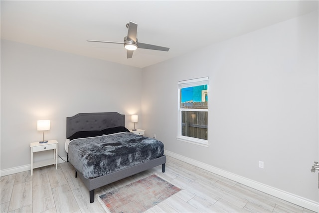 bedroom featuring ceiling fan and light hardwood / wood-style flooring