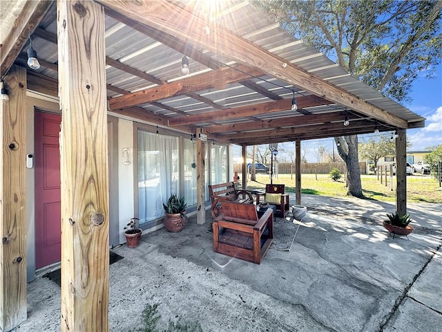 view of patio / terrace featuring fence