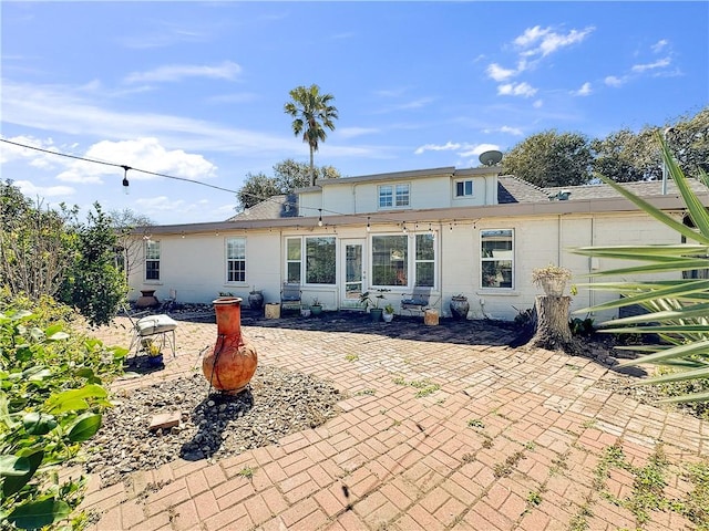 rear view of house featuring a patio area