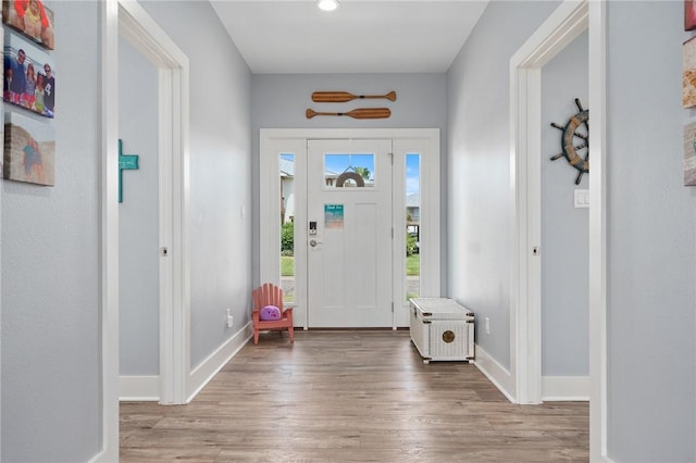 foyer with light hardwood / wood-style floors