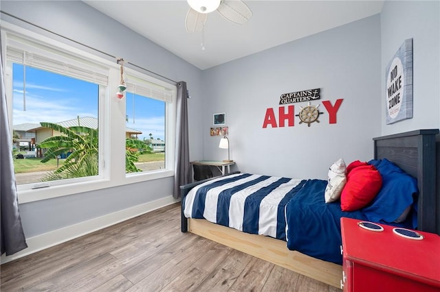 bedroom with hardwood / wood-style flooring and ceiling fan