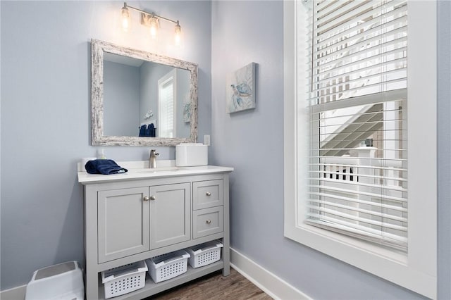 bathroom featuring vanity and hardwood / wood-style flooring