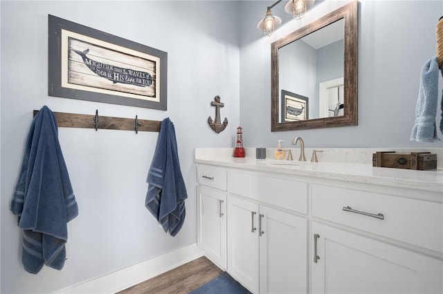 bathroom with wood-type flooring and vanity