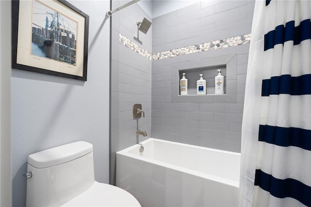 bathroom featuring shower / bathtub combination with curtain and toilet