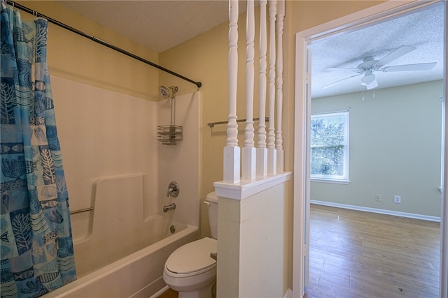 bathroom featuring hardwood / wood-style floors, shower / bath combination with curtain, a textured ceiling, and toilet