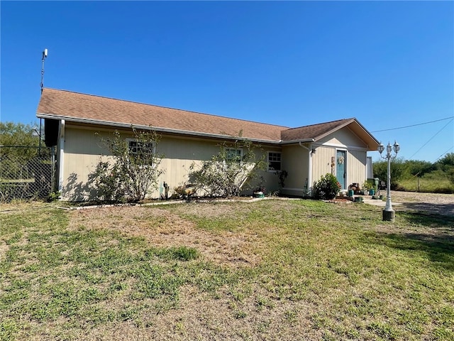 view of front of property with a front lawn