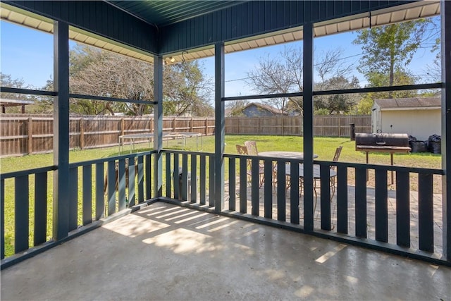 unfurnished sunroom with plenty of natural light