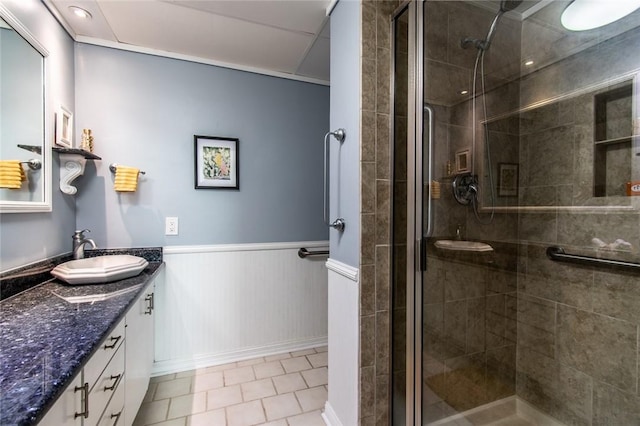 4600 Ocean Dr Unit 505, Corpus Christi, TX 78412 - full bath featuring vanity, a shower stall, wainscoting, and tile patterned flooring