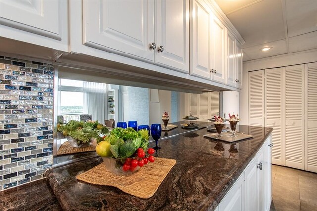 4600 Ocean Dr Unit 505, Corpus Christi, TX 78412 - kitchen with white cabinets, recessed lighting, dark stone countertops, and light tile patterned floors