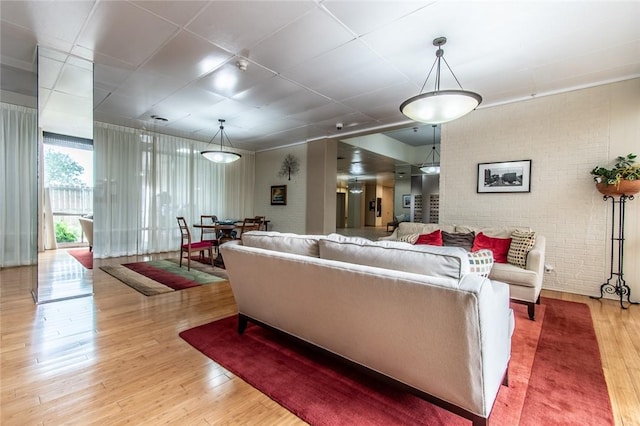4600 Ocean Dr Unit 505, Corpus Christi, TX 78412 - living room with light wood-style flooring and brick wall