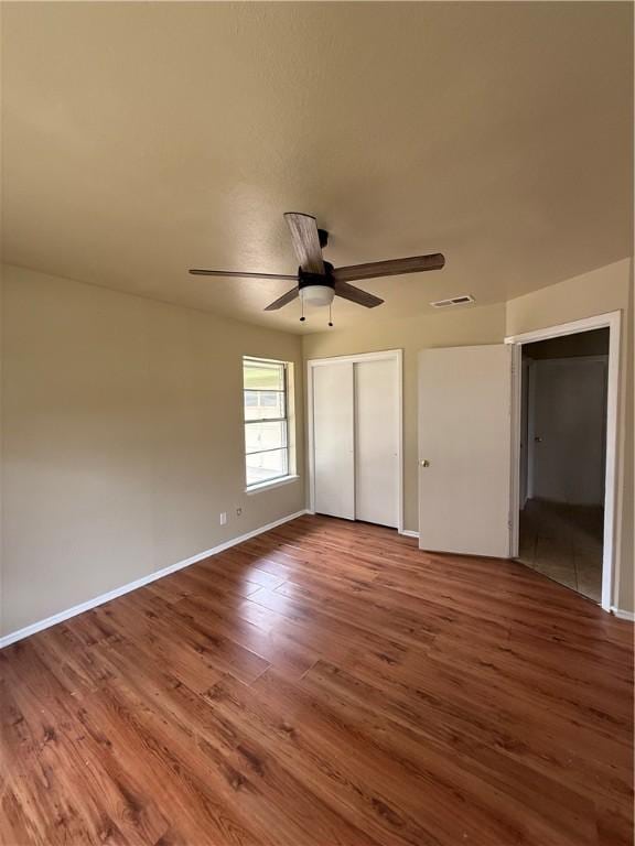1005 Schallert Dr, Alice, TX 78332 - unfurnished bedroom featuring wood finished floors, a closet, and baseboards