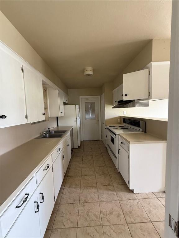 1005 Schallert Dr, Alice, TX 78332 - kitchen with white appliances, a sink, range hood, white cabinetry, and light countertops