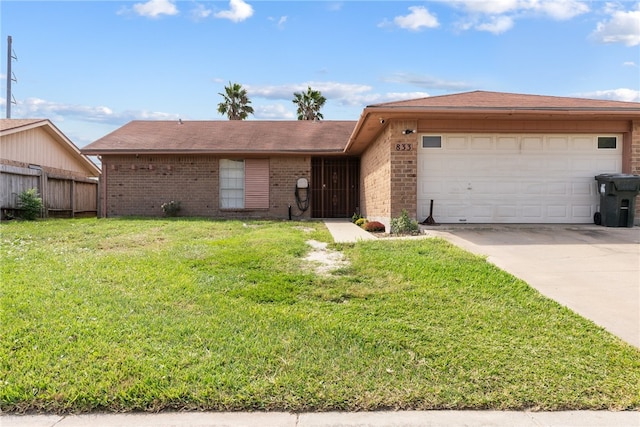 ranch-style house with a garage and a front yard