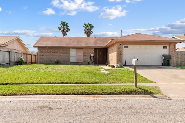 ranch-style home featuring a garage and a front lawn