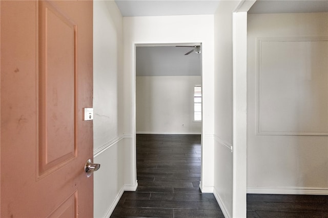 corridor featuring dark wood-type flooring