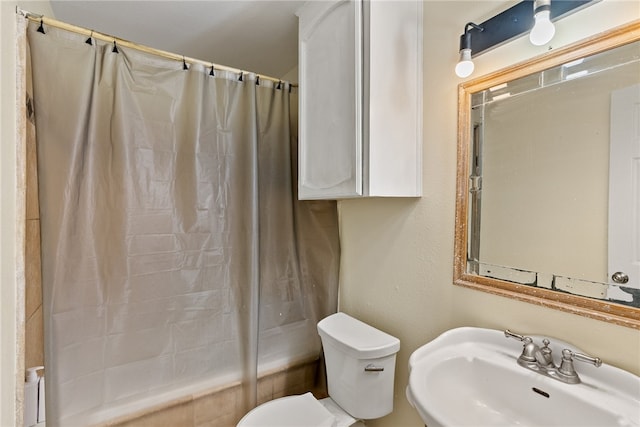 full bathroom with shower / bath combo, sink, and toilet