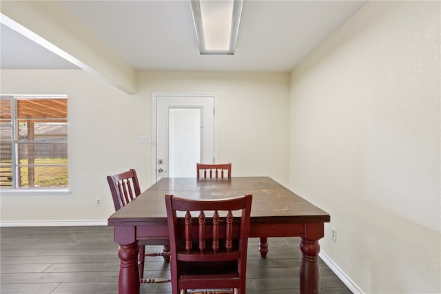 dining room with dark wood-type flooring