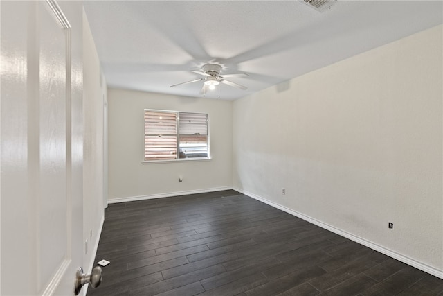 empty room with dark wood-type flooring and ceiling fan