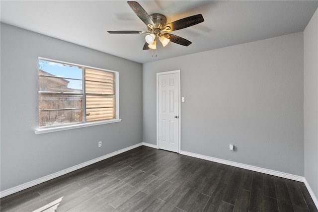 unfurnished room featuring ceiling fan and dark hardwood / wood-style floors