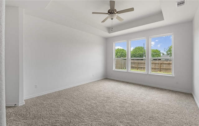 3401 Travis Ct, Corpus Christi, TX 78414 - carpeted spare room with a raised ceiling, baseboards, and ceiling fan