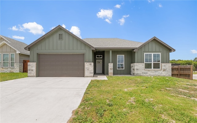 3401 Travis Ct, Corpus Christi, TX 78414 - view of front of property with board and batten siding, an attached garage, stone siding, and a shingled roof