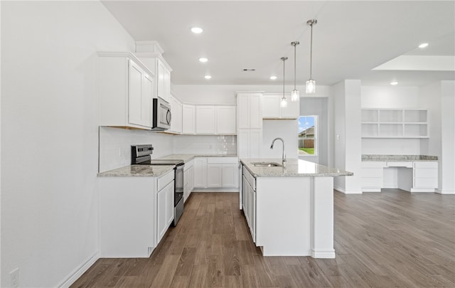 3401 Travis Ct, Corpus Christi, TX 78414 - kitchen with appliances with stainless steel finishes, a sink, recessed lighting, light stone countertops, and dark wood-style flooring
