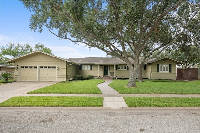 ranch-style home featuring a front yard and a garage