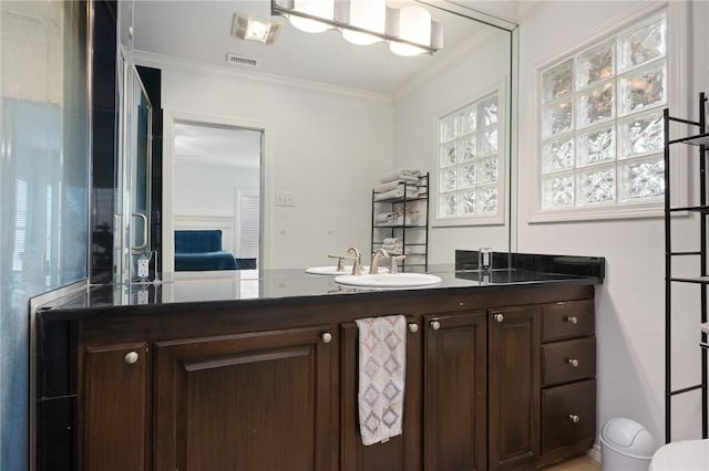 bathroom with vanity and ornamental molding