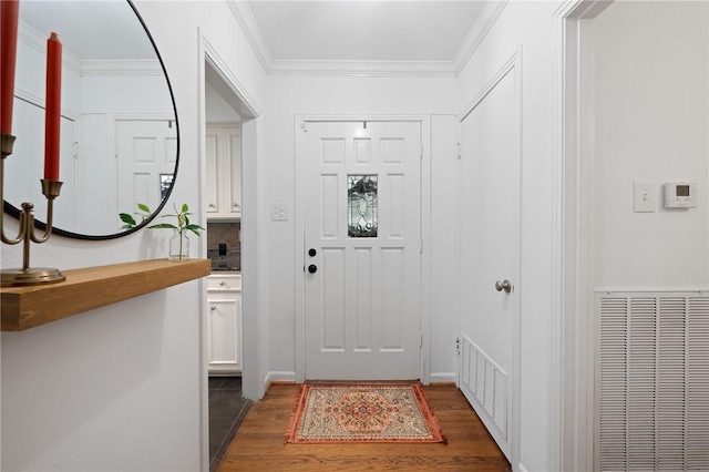 entryway featuring crown molding and dark hardwood / wood-style floors