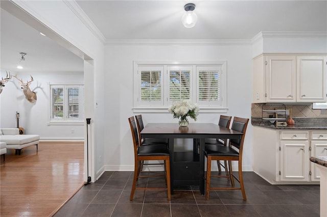 tiled dining area with crown molding