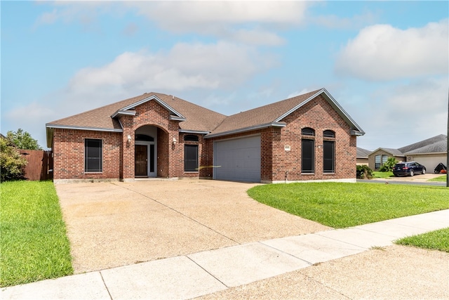 ranch-style home with a front yard and a garage