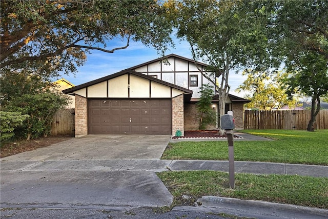 7006 Powderhorn Ct, Corpus Christi, TX 78413 - tudor house featuring a garage, driveway, stucco siding, and brick siding
