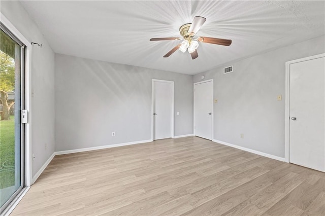7006 Powderhorn Ct, Corpus Christi, TX 78413 - unfurnished bedroom featuring light wood-style floors, access to outside, and a ceiling fan