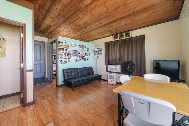 office space featuring light wood-style floors, wood ceiling, baseboards, and cooling unit