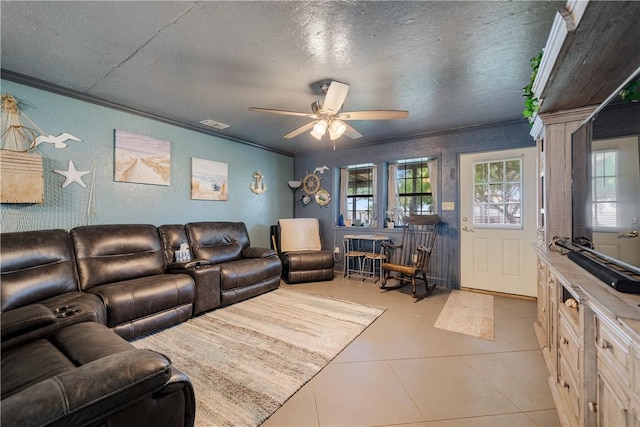 living area with crown molding, a textured ceiling, plenty of natural light, and ceiling fan