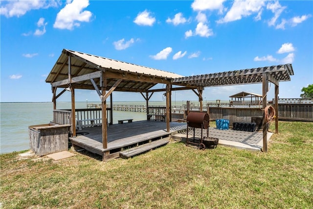 exterior space featuring a pergola and a water view