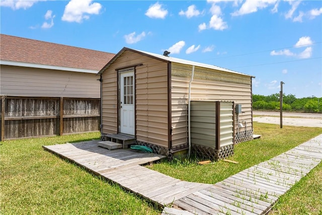 view of shed featuring fence