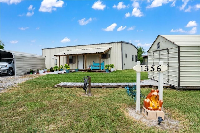 exterior space featuring an outdoor structure, board and batten siding, and a yard