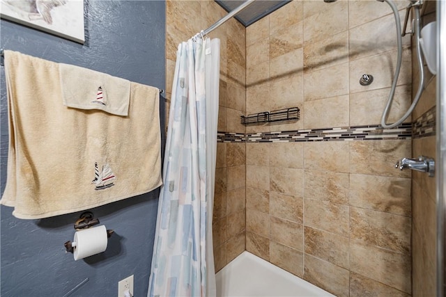 bathroom with a shower stall
