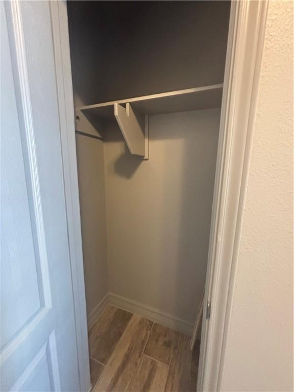 106 Guadalupe Palm Cir, Portland, TX 78374 - corridor with a raised ceiling, arched walkways, wood finished floors, and ornamental molding