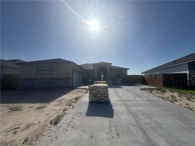 106 Guadalupe Palm Cir, Portland, TX 78374 - ranch-style house featuring an attached garage and driveway