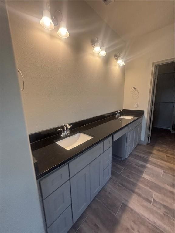 106 Guadalupe Palm Cir, Portland, TX 78374 - full bathroom featuring double vanity and wood finished floors