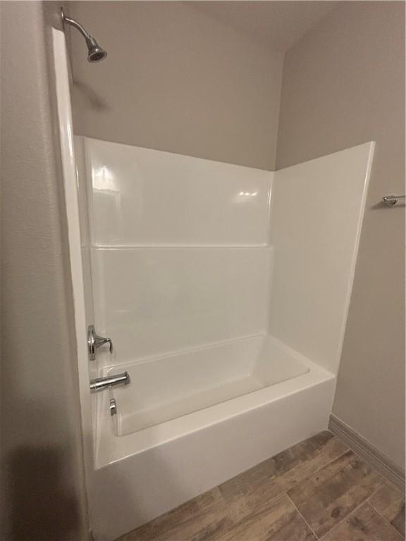 106 Guadalupe Palm Cir, Portland, TX 78374 - bathroom featuring vanity, a garden tub, a stall shower, and wood finished floors