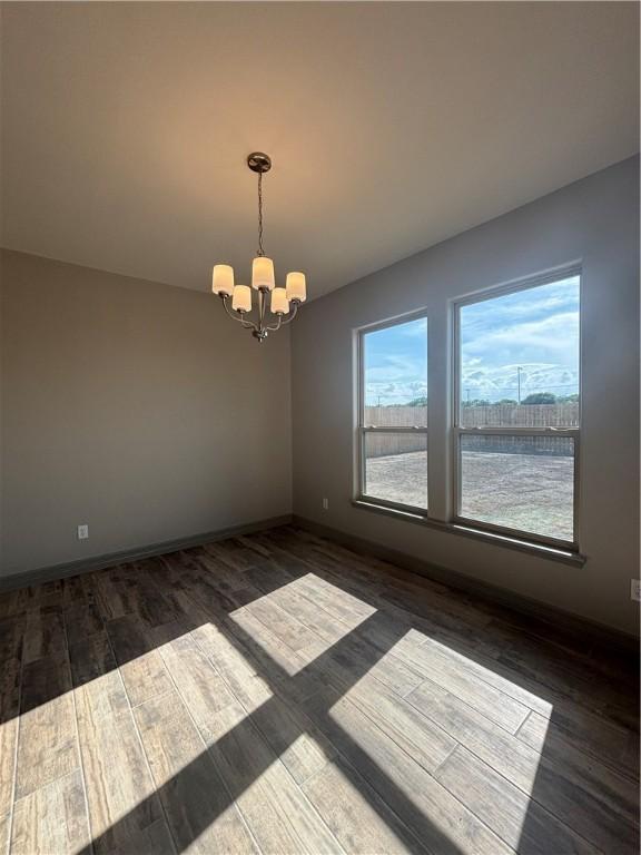 106 Guadalupe Palm Cir, Portland, TX 78374 - unfurnished living room with a raised ceiling, dark wood-style flooring, ceiling fan, arched walkways, and recessed lighting