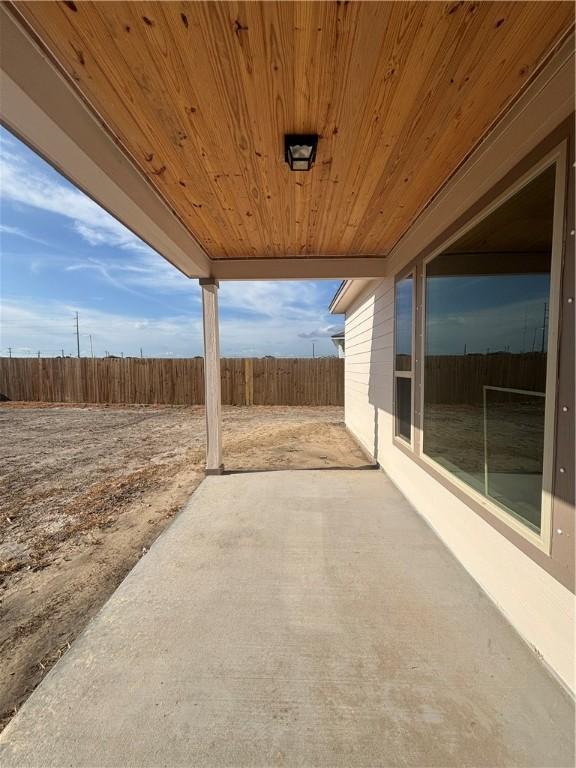 106 Guadalupe Palm Cir, Portland, TX 78374 - unfurnished room with dark colored carpet and baseboards