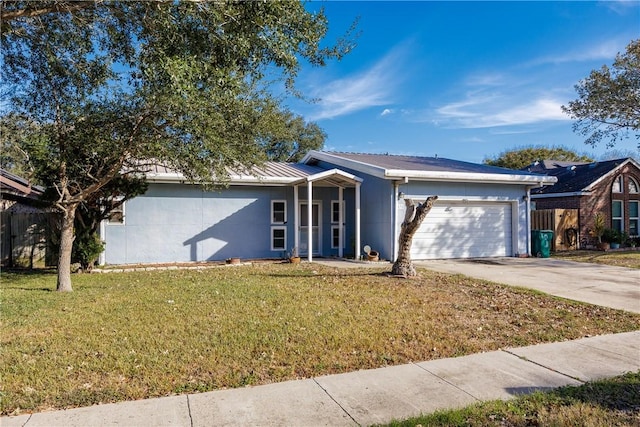 ranch-style house featuring a front yard and a garage