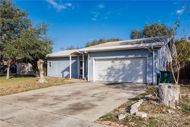 single story home featuring a front yard and a garage